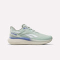 Dew-colored Women's Viva Speed Shoes by Reebok, featuring white stripes, hazy blue accents, a breathable mesh upper, and a thick cream sole with cushioned midsole—all shown in side profile on a plain white background.