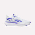 Introducing the Reebok Women's Viva Speed Shoes in White/Solar Purple/Black. Featuring a mesh upper for breathability, lace-up closure, and stylish solar purple accents with coordinating sole details, these athletic running shoes offer a cushioned design for all-day comfort. Displayed on a plain white background.