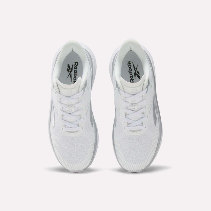 Top view of a pair of white Reebok Women’s Viva Speed Shoes with gray details, placed side by side on a plain light background. These Viva Speed shoes are designed to be both breathable and cushioned, offering comfort and support with every step.