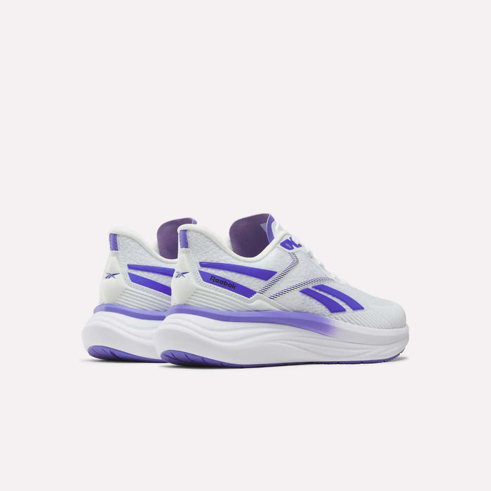 A pair of Women's Viva Speed Shoes by Reebok in white with purple accents and thick, cushioned soles, displayed from the back and side against a plain white background. These breathable sneakers offer a stylish and comfortable option for everyday wear.