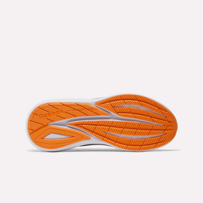 The bottom of a Women's Viva Speed Shoe by Reebok, showcasing an orange and white sole with textured tread and the Reebok logo embossed on the left side, designed for breathable comfort and cushioned support.