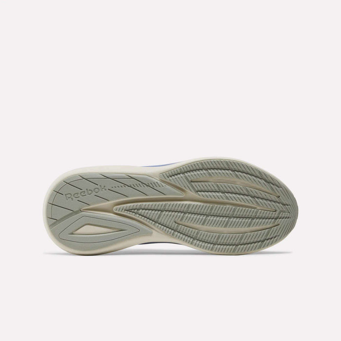 The image displays the sole of the Reebok Women's Viva Speed Shoes, showcasing a light gray color with textured tread patterns and the Reebok logo engraved on the heel. These cushioned running shoes provide enhanced comfort and grip, making them ideal for everyday wear.