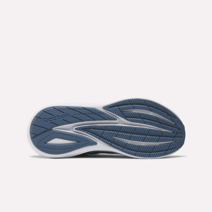 The image displays the sole of Reebok Women's Viva Speed Shoes with a blue and white design, textured and smooth patterns for traction, flexibility, added cushioning, and the Reebok logo on the left side.