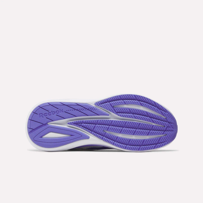The image displays the purple and white sole of the Reebok Women's Viva Speed Shoes, highlighting its textured tread pattern and branding against a plain white background. These cushioned sneakers offer both comfort and style, making them an excellent choice for anyone seeking breathable everyday footwear.