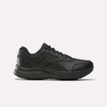 A black, low-profile athletic sneaker featuring a textured sole and black laces—pictured in side view against a plain white background—blends the sleek style of Reebok’s Women’s Walk Ultra 7 DMX Max Shoes (Wide D) in Black/Cold Grey 5/Collegiate Royal with an emphasis on all-day comfort.