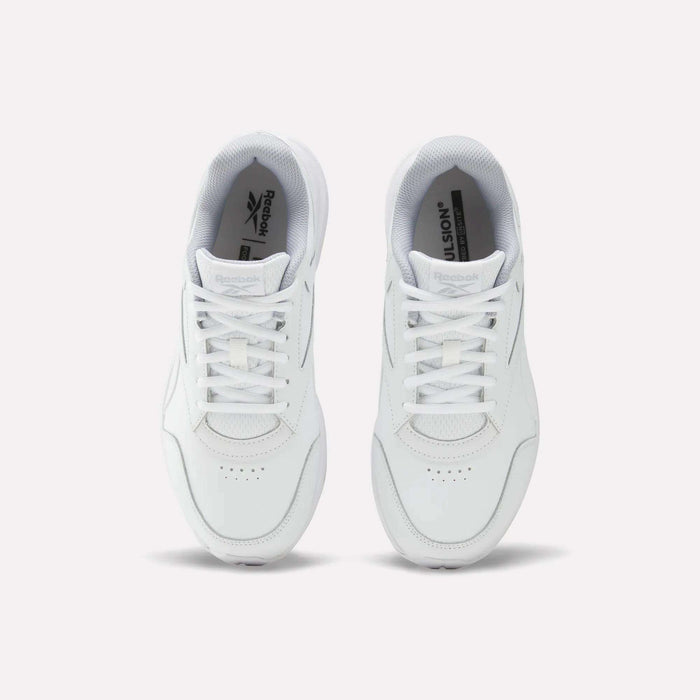 A pair of Women’s Walk Ultra 7 DMX Max Shoes - Wide D by Reebok in white, viewed from above with visible laces and the Reebok logo on the insoles against a plain white background. Engineered for all-day comfort, these sneakers are ideal for everyday wear.