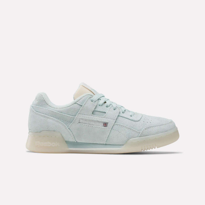 The Women's Workout Plus Shoes by Reebok feature light mint green suede, matching laces, a beige tongue, and a translucent off-white rubber sole that captures classic 80s fitness style. Displayed on a plain white background.