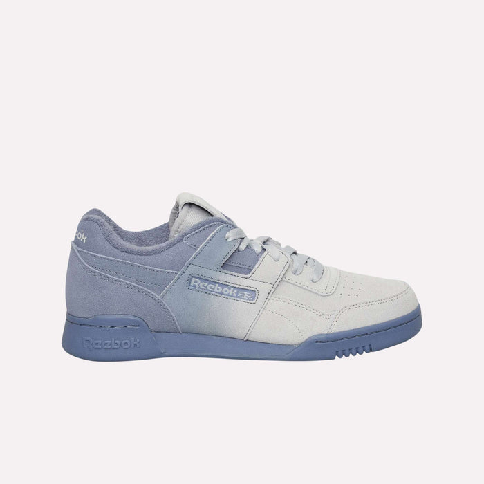 A side view of the Reebok Workout Plus Og Shoes, showcasing a classic silhouette with a gradient design that transitions from light gray at the toe to light blue at the heel and sole. The shoes are finished with matching laces and the iconic Reebok logo on the side, making these retro sneakers a perfect blend of style and heritage.