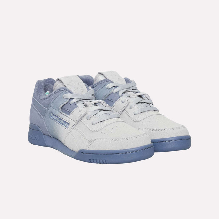 A pair of light gray and pastel blue Reebok Workout Plus OG Shoes with laces, side Reebok logo, perforated toe boxes, and blue rubber soles, displayed on a white background. These retro sneakers feature a classic silhouette that embodies timeless style.