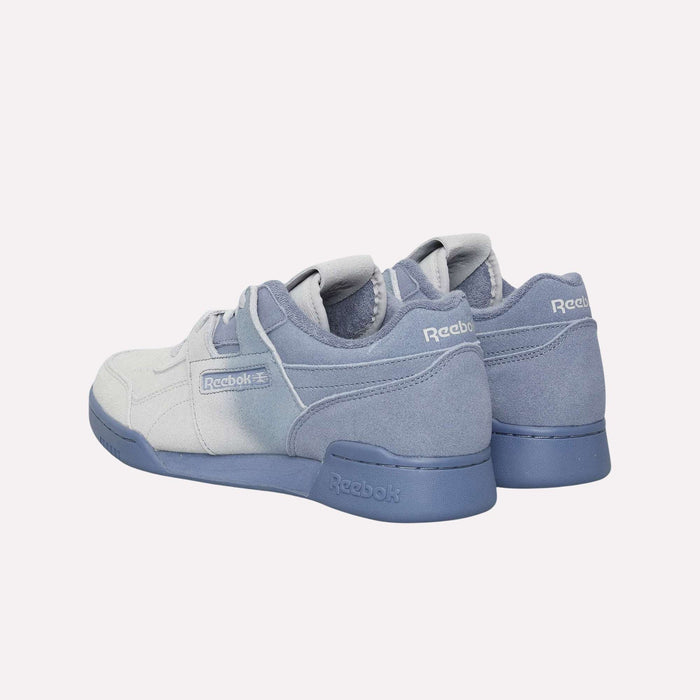 A pair of Reebok Workout Plus Og Shoes in light blue and grey with blue soles, showcasing a classic silhouette, are displayed from the back and side on a plain white background.