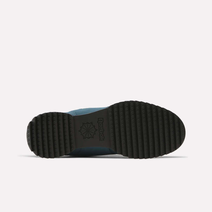 The bottom view of the Reebok Workout Plus Ripple Shoes showcases a black rubber sole with a ribbed tread pattern and features the Reebok logo and star emblem in the center against a plain white background, emphasizing the durability and traction that make these sneakers weather-ready.