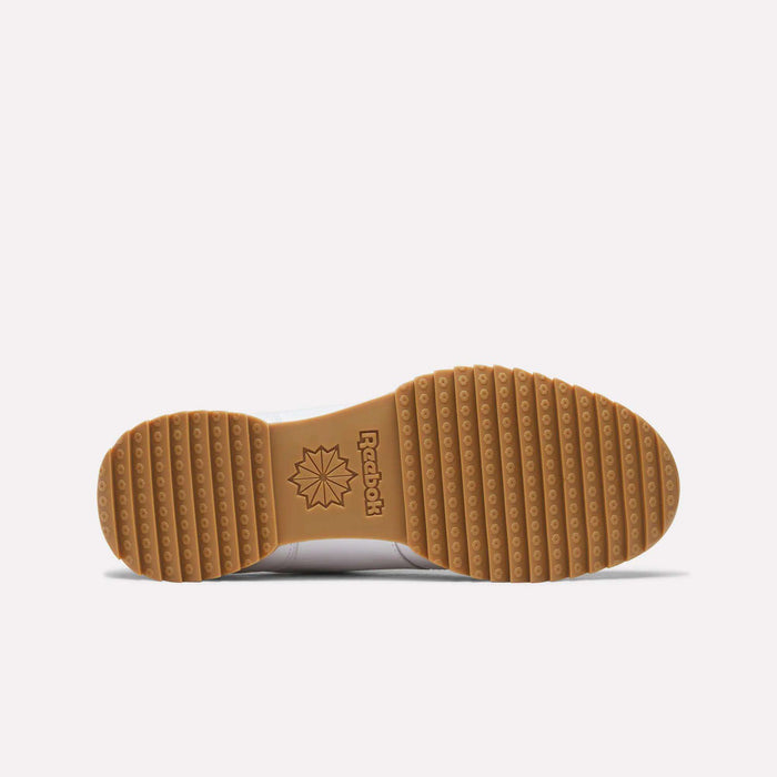 The image shows the bottom view of Reebok Workout Plus Ripple Shoes featuring a gum rubber sole with horizontal ridges, circular patterns, and an embossed Reebok logo at the center for a subtle vintage style.