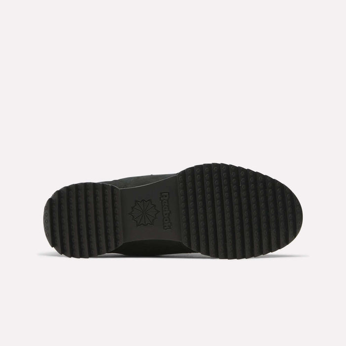 The image displays the black rubber sole of the Reebok Workout Plus Ripple Shoes, viewed from underneath. The sole features horizontal and circular grip patterns—perfect for weather-ready sneakers—and showcases a sunburst logo along with “Reebok” embossed at the center.