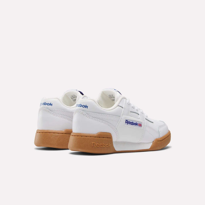 The Reebok Workout Plus Shoes for little kids feature a classic white design with gum rubber soles and blue logos, low-top styling, and are shown side by side on a plain white background.