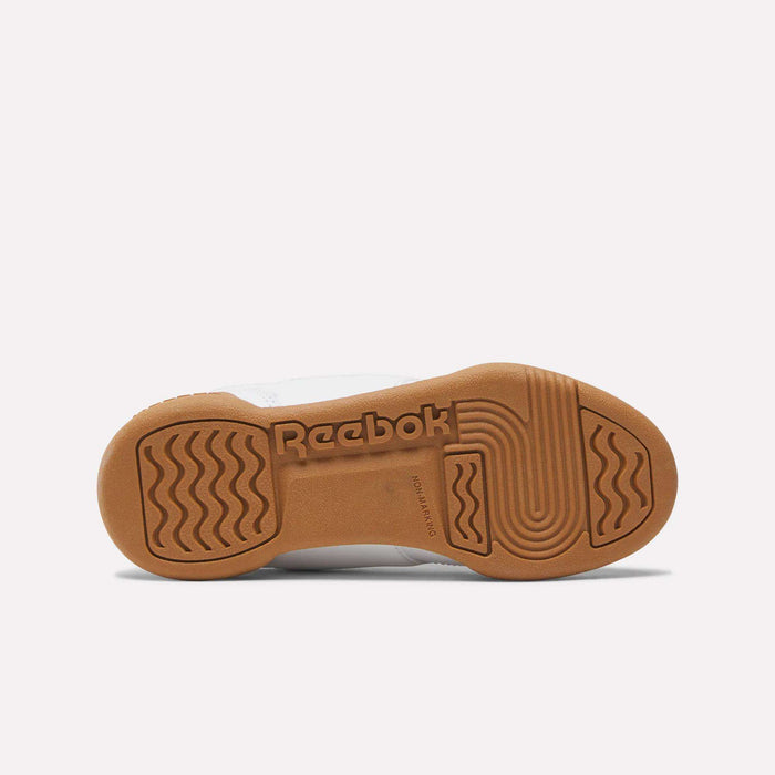 A brown rubber outsole on the Reebok Workout Plus Shoes for little kids is shown from the bottom, displaying the Reebok logo and textured grip patterns—ideal traction for active days.
