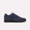 A navy blue suede Reebok Workout Plus shoe with a black sole, blue laces, and side Reebok logo with Union Jack captures classic '80s fitness style, displayed on a clean white background.