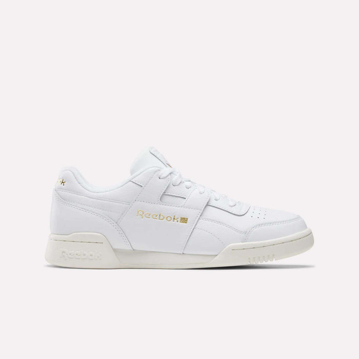 The Reebok Workout Plus Shoes in Chalk/Ftwrwhite/Goldmetallic feature a low-top design with white laces and gold branding, showcased on a plain light background—a true tribute to classic '80s fitness style.