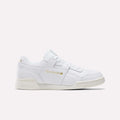 The Reebok Workout Plus Shoes in Chalk/Ftwrwhite/Goldmetallic feature a low-top design with white laces and gold branding, showcased on a plain light background—a true tribute to classic '80s fitness style.