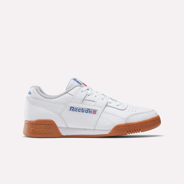 The Reebok Workout Plus Shoes feature a white design with gum soles, blue and red side logo accents, and white laces, showcasing classic '80s fitness style in a sleek profile against a plain light background.