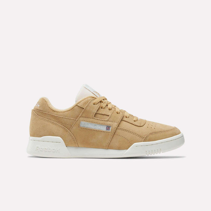 Reebok Workout Plus Shoes in tan suede with a white sole, beige laces, and side logo patch, shown in profile on a white backdrop—reviving '80s workout style and the classic sneaker legacy.