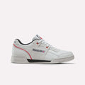 A side view of the Reebok Workout Plus Shoes in Grey 1/Black/Vector Red showcases vintage-inspired design with classic Reebok branding on the side and tongue, gray suede accents, black lining, and red trim—all set against a plain white background. These shoes merge timeless style with modern comfort.