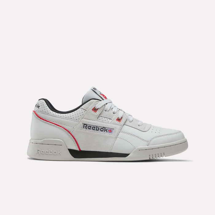 A side view of the Reebok Workout Plus Shoes in Grey 1/Black/Vector Red showcases vintage-inspired design with classic Reebok branding on the side and tongue, gray suede accents, black lining, and red trim—all set against a plain white background. These shoes merge timeless style with modern comfort.