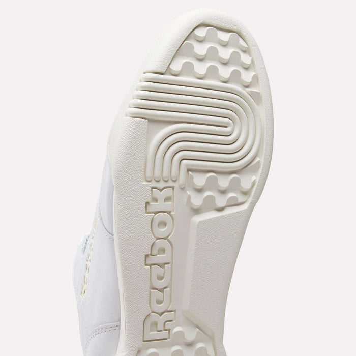 Close-up of the white sole on Reebok Workout Plus Shoes, highlighting the textured tread and embossed logo—echoing classic '80s fitness style.