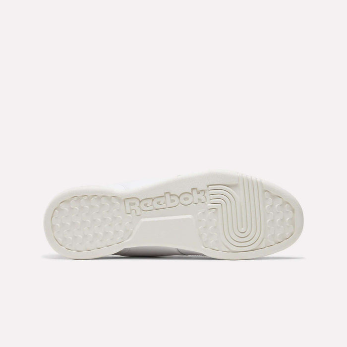 The image displays the white rubber sole of Reebok Workout Plus Shoes, with the Reebok logo and grip-enhancing textures, reflecting '80s fitness style on a plain light background.