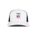 The Reebok Woven Patch Vector Trucker Cap is white with black mesh sides, a curved brim, and a navy/red logo patch. This adjustable snapback is shown on a plain white background.