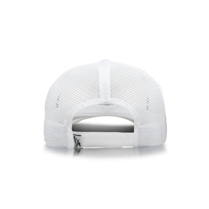 The image shows the back of the Reebok Woven Patch Vector Trucker Cap with mesh panels, an adjustable snapback closure, and a small fabric tag near the opening.
