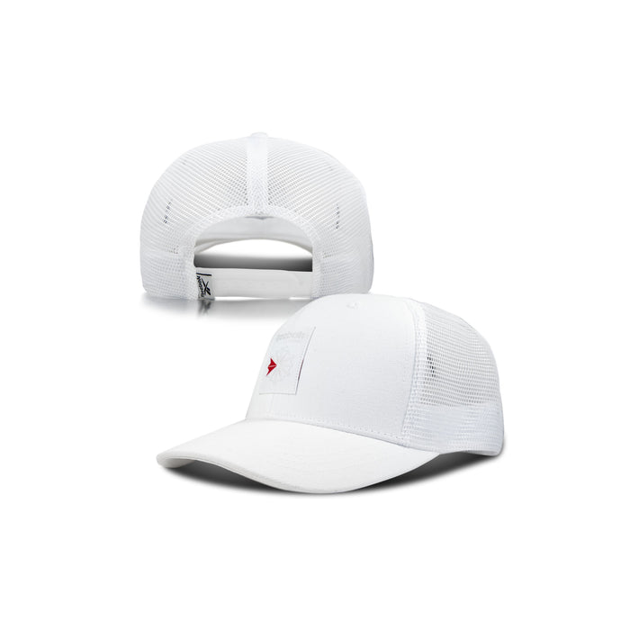 The Reebok Woven Patch Vector Trucker Cap is shown from the front and back, featuring a small red Reebok arrow logo on a white patch, plus mesh back panels and an adjustable snapback closure.