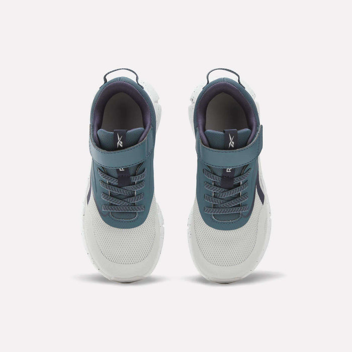 A top-down view of the Reebok Zig Dynamica 6 Running Shoes for little kids in teal and white. These shoes feature Zig technology, a combination of laces and velcro strap, a textured sole, and a dark inner lining to provide enhanced comfort and support.