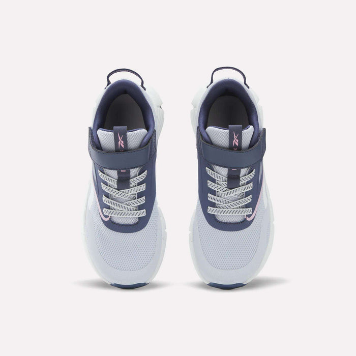 A pair of Reebok Zig Dynamica 6 Shoes for little kids, showcasing white mesh toes, blue sides, patterned laces, and Velcro straps, displayed from above on a plain white background.