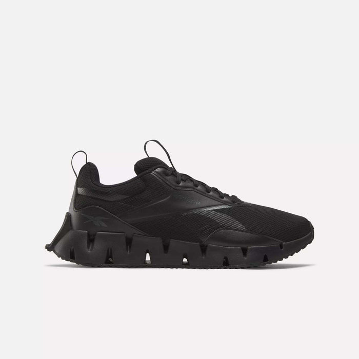 A black Reebok Zig Dynamica STR shoe with a chunky sculpted FuelFoam midsole and mesh upper, shown in side profile against a plain white background.