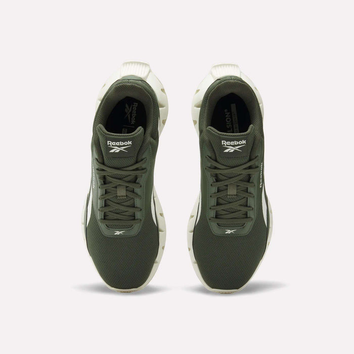 Top view of a pair of Reebok Zig Dynamica STR Shoes in olive green with white soles, featuring breathable mesh uppers, positioned side by side on a plain light background.