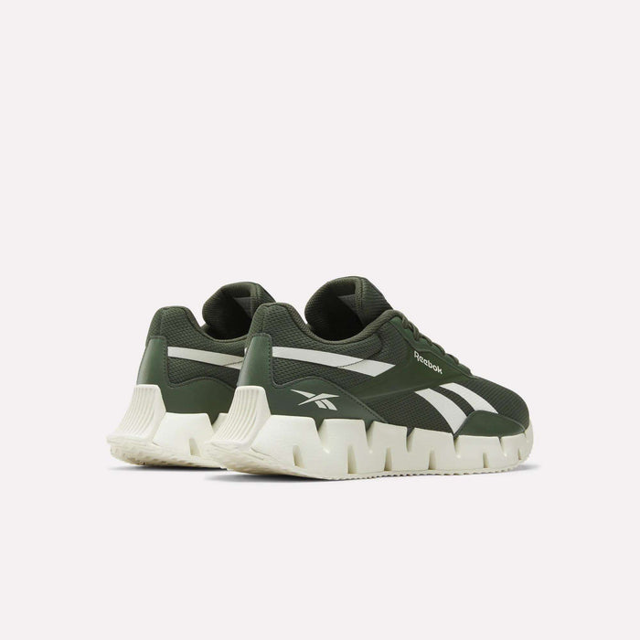 A pair of Reebok Zig Dynamica STR Shoes in green feature breathable mesh, white chunky soles, and white accents, shown from the back and side on a plain white background.