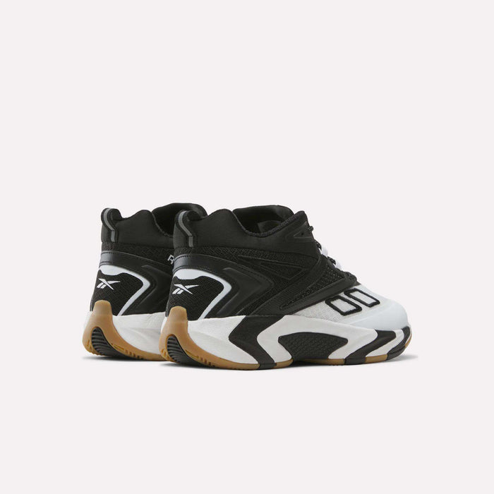 A pair of Reebok Zone Breaker Shoes for big kids, featuring a black and white color scheme with chunky soles and tan accents, designed to provide excellent ankle support, displayed from the back and slightly angled to the side against a plain white background.