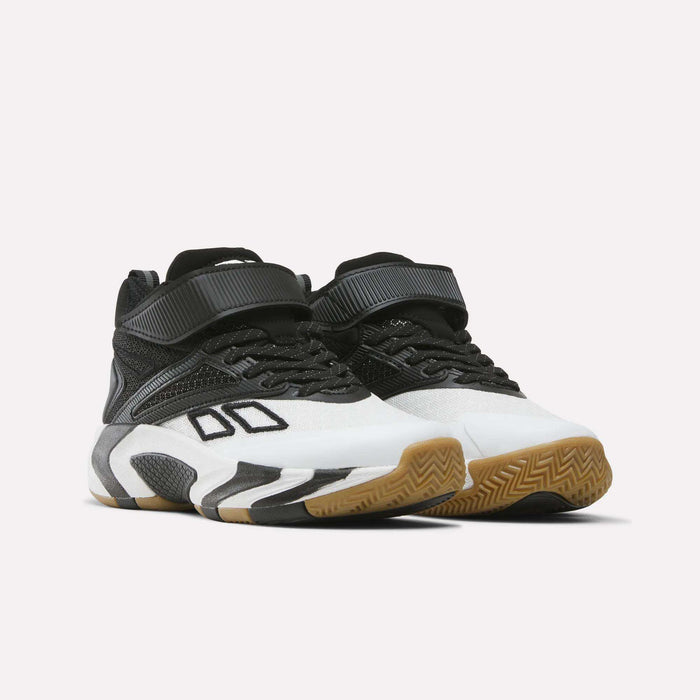 A pair of Reebok Zone Breaker Shoes for little kids—these boys’ high-top basketball sneakers feature a mid-cut design in black, white, and gray with gum soles, black straps, and geometric side patterns—displayed against a plain white background.
