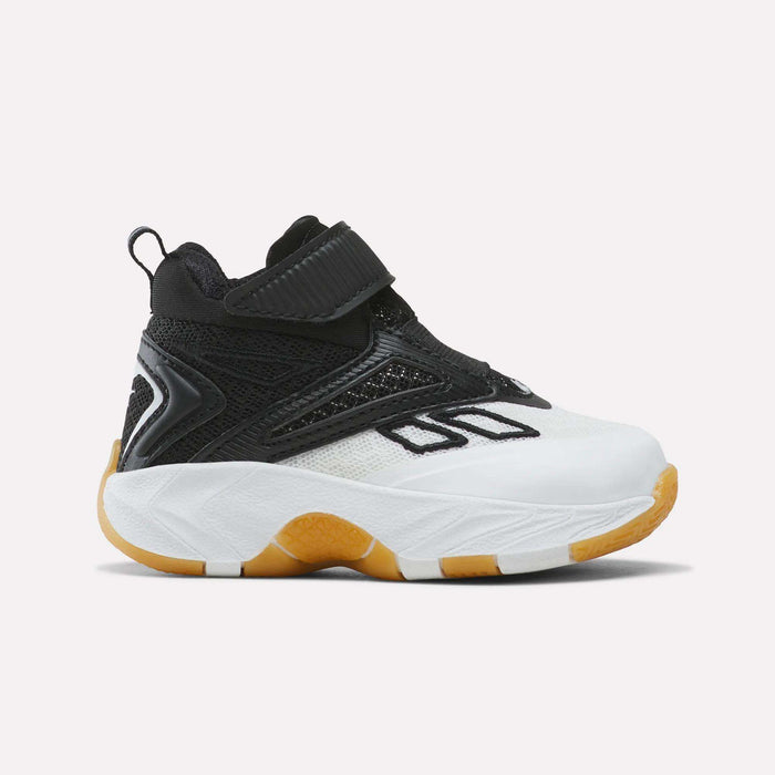 The Reebok Zone Breaker Shoes - Toddler in White/Black/Gum are shown in side profile on a plain background, featuring a thick sole, mesh upper, Velcro strap, and supportive ankle design.