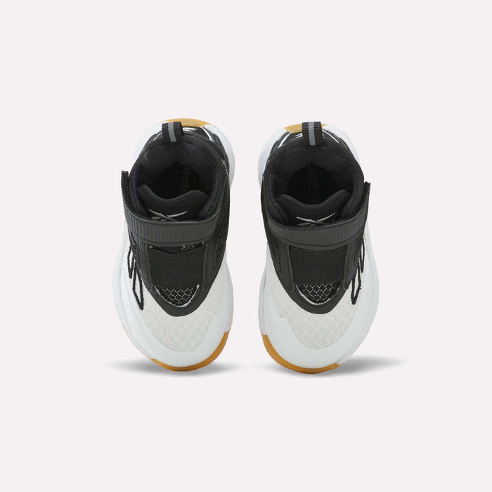 A pair of Reebok Zone Breaker Shoes - Toddler in black, white, and brown are displayed side by side on a light background, viewed from above to highlight the tops, laces, and straps. These basketball shoes offer a supportive ankle design that delivers comfort and style for active little boys.